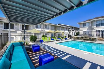 Two swimming pools with lounge seating